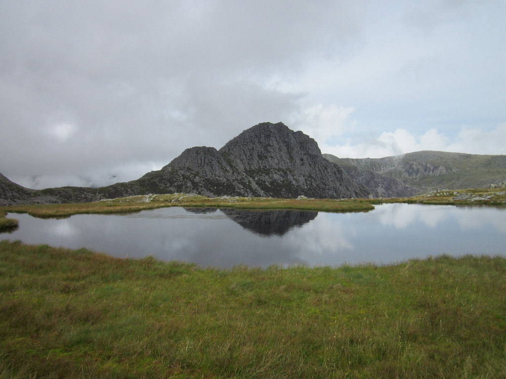 Tryfan reflected in the waters of Llyn Caseg-fraith in the Glyderau, North Wales. Aug 2015.